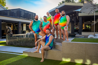 6 men wearing the bright claw pattern swimwear and tanks